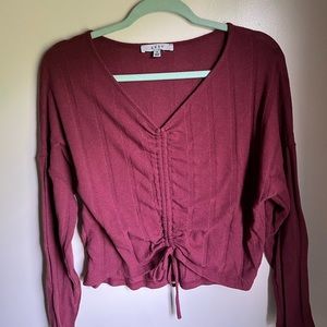 maroon long sleeved top